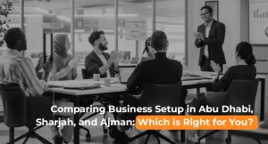 Business team discussing company formation in Abu Dhabi, Sharjah, and Ajman to choose the best emirate for business setup in UAE.