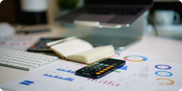 Business desk showing analytics, charts, and tools used for company registration in Dubai.